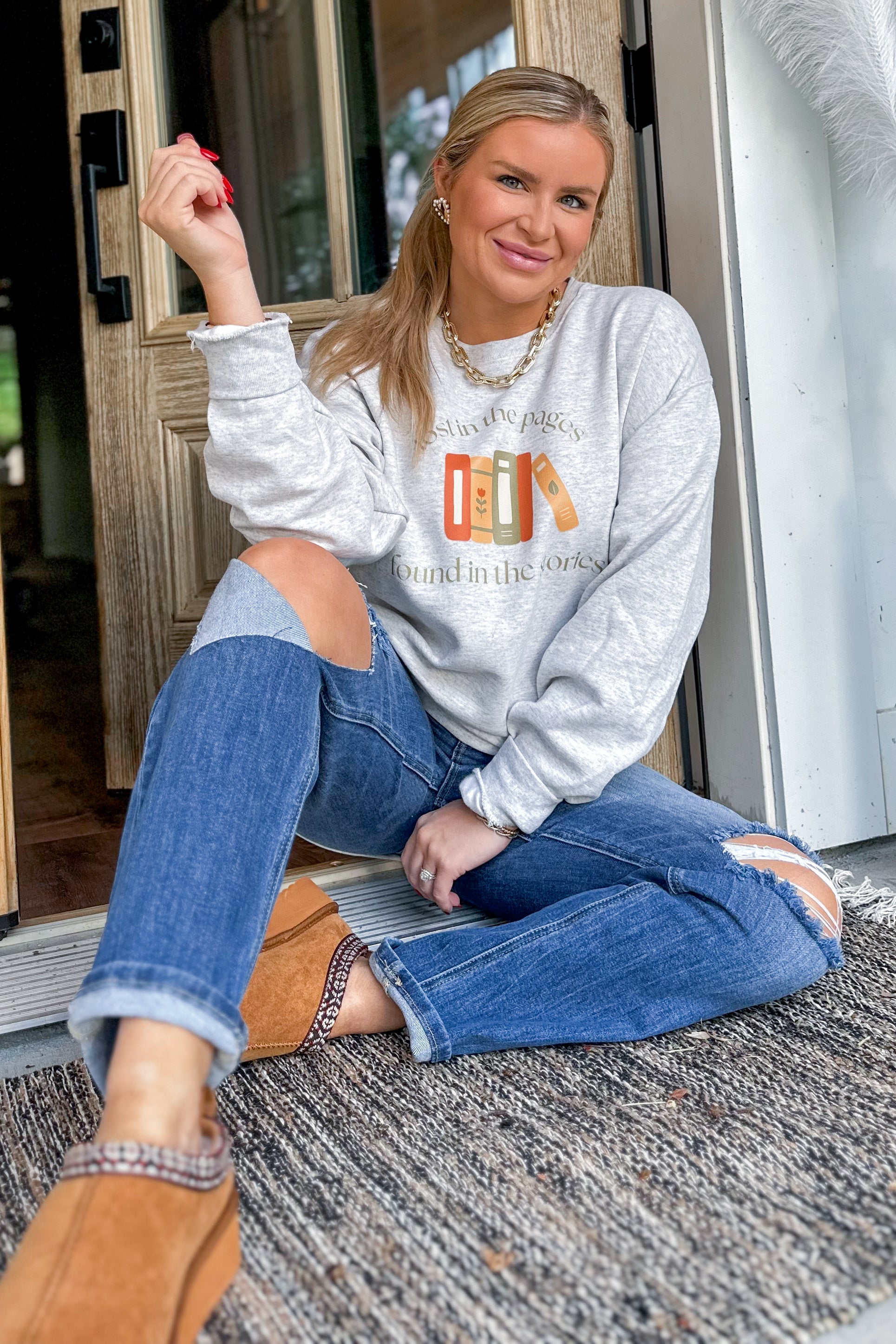 Lost In The Pages Long Sleeve Graphic Sweatshirt - Be You Boutique